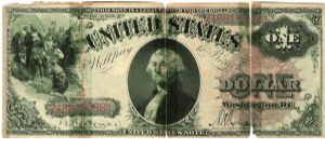 1880 United States notes. It is in 3 bits, taped together but the paper is still crisp. I would assume this was folded, hidden in a book, and then unfolded after it was there a long time and became brittle. Banknote