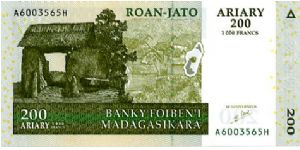 200 Ariary/1000 Francs
Greens
High plateau village gate
Aloalo (Tomb sculptures).
Security thread
Wtmrk Zebu's head Banknote