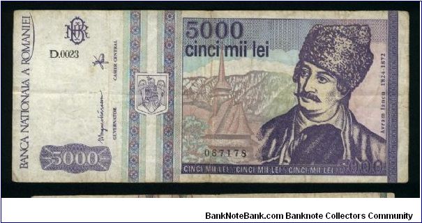 5000 Lei.

Square-topped shield at left (May 1993).

Avram Iancu and church on face; church, the gate of Alba Iulia stronghold and gray seal on back.

Pick #104 Banknote