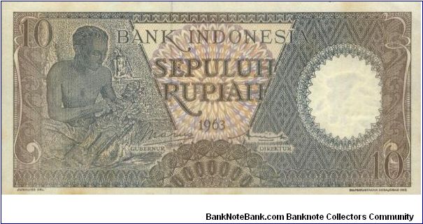10 Rupiah.Seri Pekerja Tangan 2 Series. Signed By Soemarno & Hertatijanto.(O)Wood Carver(R)A Native House. Watermark Buffalo Head.135x66mm Banknote
