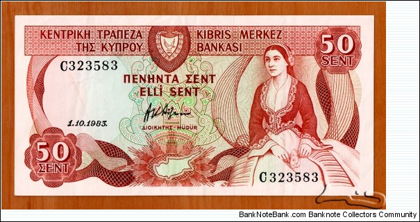 Cyprus | 
50 Sen, 1983 | 

Obverse: Cypriot woman wearing national dress | 
Reverse: Yermasoyia Hydroelectric Dam | Banknote