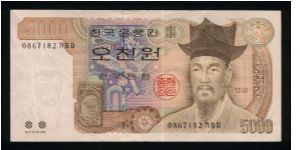 5000 Won.

Yi I and two raised colored dots for blind at lower left on face; Ojukon, birthplace of Yi I, on back.

Pick #51 Banknote