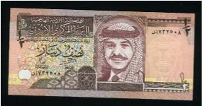 1/2 Dinar.

King Hussein wearing headdress at center on face; Qusayr Amra fortress on back.

Pick #28b Banknote