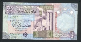 1/2 Dinar.

Oil refinery at left center on face; irrigation system at left center on back.

Pick #63 Banknote