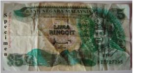 Malaysia 5 Ringgit  Front Design: Decorative foliage patterns based on woodcarvings from Negeri Sembilan surround the portraits of DYMM the first Yang Di Pertuan Agong on the front of the note. Banknote