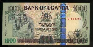 1,000 Shillings.

Farmers at left, arms at upper center and lower right, vertical OVD strip at center right on face; grain storage facility at center on back.

Pick #New Banknote