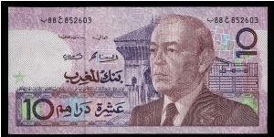 10 Dirhams.

Older bust of King Hassan II at right on face; musical instruments and pillar at left on back.

Pick #63b Banknote