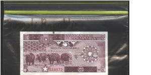 Brown-violet. Cape buffulo herd at left center. Havesting bananas on back. Banknote