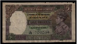 Reserve Bank of India 5 Rupees # L/25 702039. 1943, P-18b. Slight wearing along the top edge, some crinkling and yellowing but otherwise in good condition. Banknote