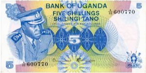 5 Shillings
Blue/Green/Pink/Brown
President Idi Amin 
Woman picking coffee 
Security thread
Watermark Bird Banknote