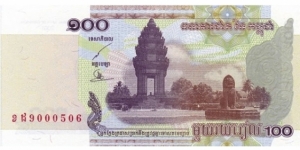 100 Riels 
2001. Purple, brown and green. Independence monument at right, naga heads sculpture at lower left center. Signature 17. Back: Students and school. Watermark: Multiple lines of text. UV: fibers fluoresce blue. Back 100 in Cambodian fluoresce yellow at right.
 Banknote