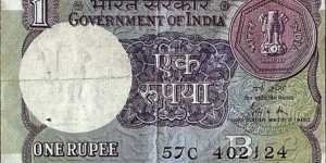 India 1989 1 Rupee.

Inset letter 'B'.

Off-centre error. Banknote