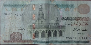 5 Egyptian Pounds 

Signature: Hisham Ramez 
Front: Ahmad Bin Tulun mosque, Cairo
Back: Frieze (Bounty of River Nile) Banknote