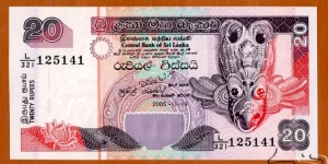 Sri Lanka | 
20 Rupees, 2005 | 

Obverse: Garula (Destroyer of Snakes), and Bird mask | 
Reverse: Fisherman, Sea shells and Exotic fish | 
Watermark: The Ceylon Lion | Banknote