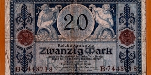 German Empire | 
20 Mark, 1915 | 

Obverse: Two male figures each holding a cornucopia (Horn of Plenty) | 
Reverse: Two portraits, which are the symbols for Work (male) and Rest (female) | Banknote