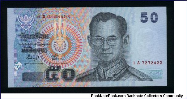 50 Bath.

King Rama IX in Field Marshal's uniform on face; King Rama VI seated at table, royal arms and medieval ship's prow on back.

Pick #new Banknote