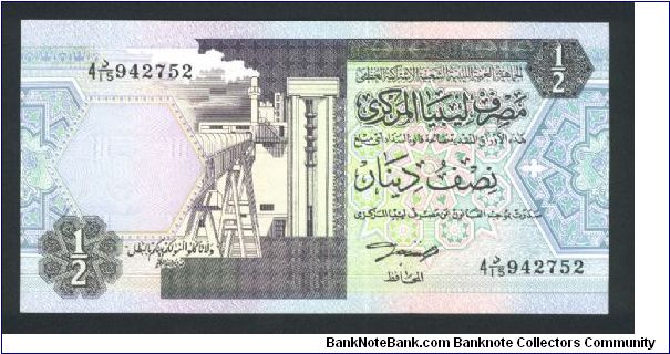 1/2 Dinar.

Oil refinery at left center on face; irrigation system at left center on back.

Pick #58b Banknote