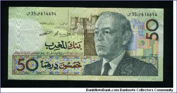 50 Dirhams.

Older bust of King Hassan II at right, fortress in background on face; mounted militia charging, flowers at center on back.

Pick #64c Banknote