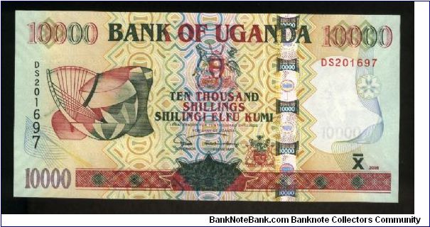 10,000 Shillings.

Musical instruments at left on face; Owen Falls dam, kudu on back.

Pick #NEW Banknote