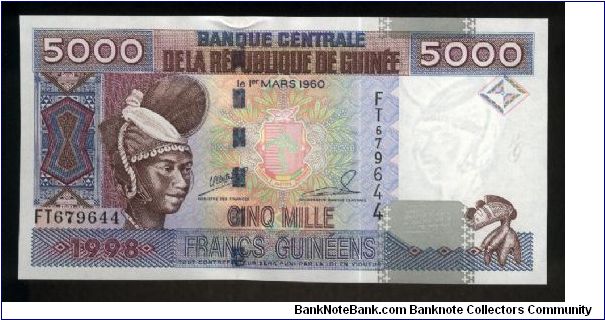 5,000 Francs.

Woman at left, arms at center on face; dam at center, mask at right on back.

Pick #38 Banknote