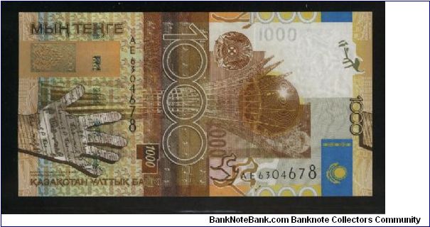 1,000 Tenge.

Astan-Baiterek Monument in Astana, some musical notes from the national anthem, hand at left and national flag at right on face; outline map of the country, fortress on a hill and buildings on back.

Pick #NEW Banknote
