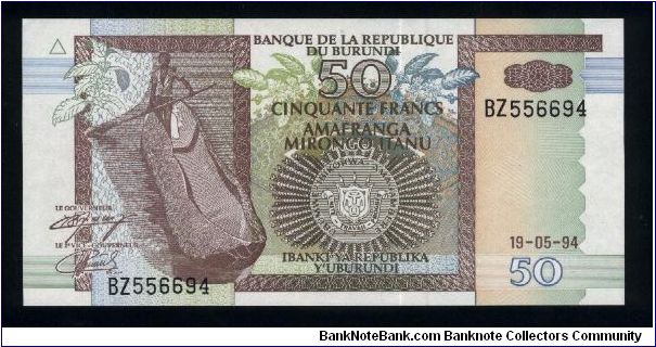 50 Francs.

Man in dugoout canoe at left, arms at lower center on face; four men with canoe at center, hippopotamus at lower right on back.

Pick #36 Banknote