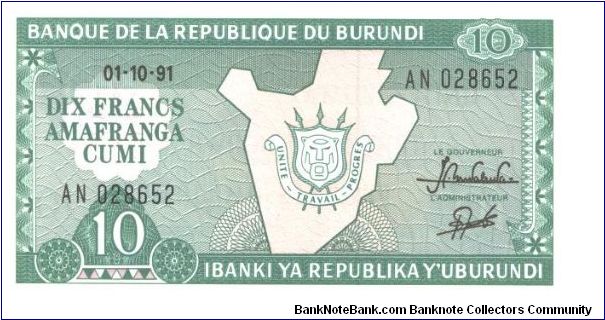Blue-green on tan umderprint. Map of Burundi with arms superimpossed at center. Banknote