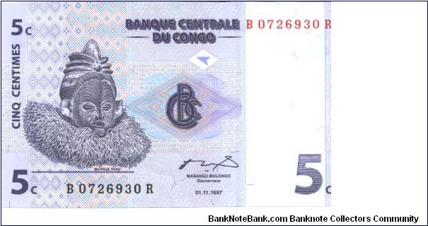 Purple on multicolour underprint. Suku mask at left Zande Harp at center right on back. Printer G&D. Banknote