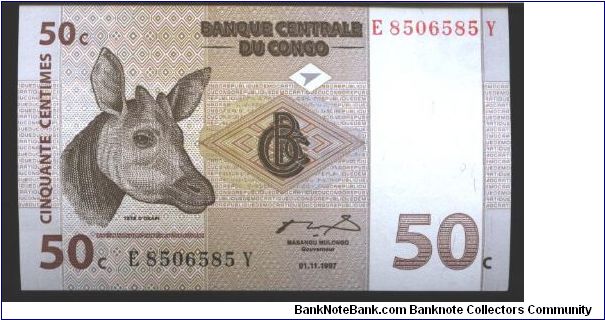 Dark brown and brown on multicolour underpront. Okapi's head at left. Family of Okapis at left center on back.

Printer: G&D Banknote