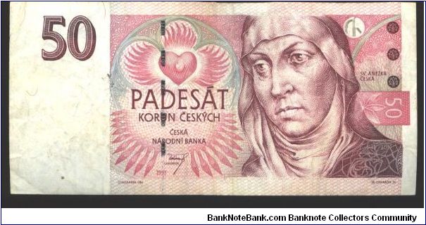 Like #4, 11

Violet and black on pink and gray underprint. St. Agnes of Bohemia at right and with crown as watermark. Large A within gothic window frame at left center on back.

Serial # prefix C D E Banknote