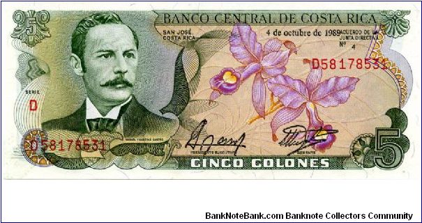 5 Colones 
Multi
Series D
Rafael Yglesias Castro & National Flower - The Guaria Morada (Cattleya skinneri), a Purple orchid 
scene of Teatro Nacional in 1897 Banknote