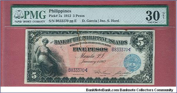 Five Pesos Bank of the Philippine Islands P-7a graded by PMG as VF-30. It has rust stains but still a nice note. Banknote