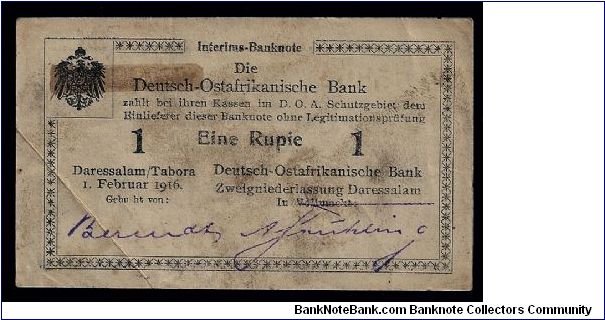 Die Deutsch Ostafrikanische Bank (German East Africa) 1 rupee dated 1916, Daressalam/Tabora. Fine condition, only one fold mark across the lower left corner.
E3 - #75864. 105mm x 62mm. Banknote