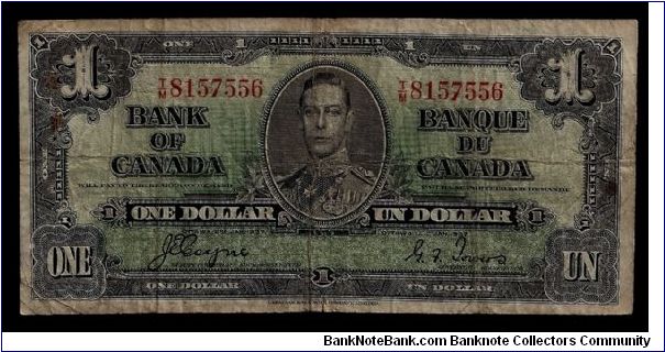 Bank of Canada One Dollar note Ottawa 8 Jan 1937 # T/M 8157556. In heavily circulated 'low grade' condition with several folds, marks and a few reddish spots. One vertical and one horizontal crease. Signed Coyne and Towers. Banknote