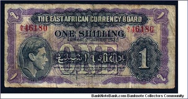 The (British) East African Currency Board 1 Shilling, dated 1st January 1943, # A/2 46180. P-27. In good condition, no rips or tears although well-worn. 120mm x 60mm. Banknote