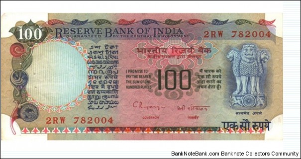 100 Rupee Note signed by C.RANGARAJAN. Watermark: Lion Capital. Dimensions: 157 × 73 mm. Main Color: Grey and Yellow. Obverse: Lion Capital, Ashoka Pillar. Reverse: Agricultural Progress and Dam. Banknote