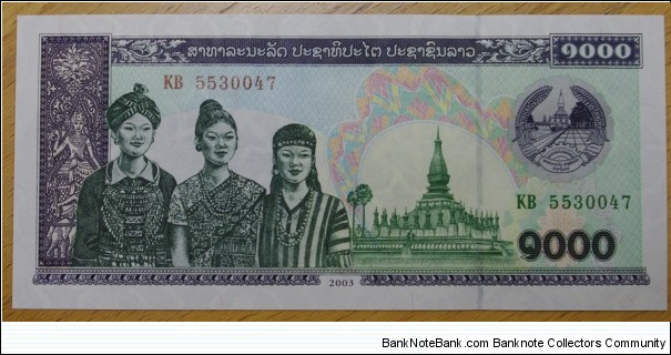 Laos | 1,000 Kip, 2003 | Obverse: Three women and Pha That Luang | Reverse: Cattle grazing | Watermark: Repeated pattern of hammer, sickle and stars Banknote