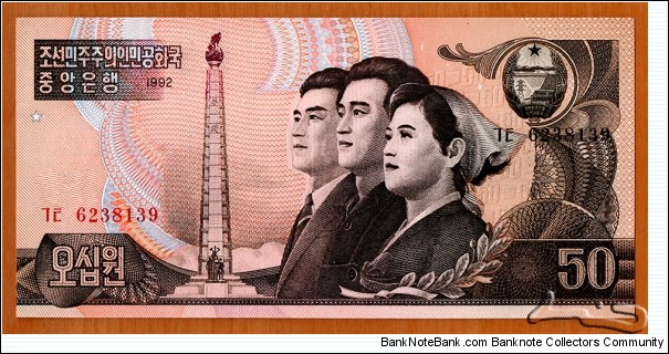 North Korea | 
50 Wŏn, 1992 | 

Obverse: Tower of the Juche Idea in Pyongyang, In front of the tower is a 30 metre high statue consisting of three figures - one with a hammer, one with a sickle and one with a writing brush (an idealised worker, a peasant and a working intellectual), and Young industry professionals | 
Reverse: Fir trees with Mt. Paekdu, and Baekdudaegan mountain range in the background | 
Watermark: Torch of Juche Ideology Tower | Banknote