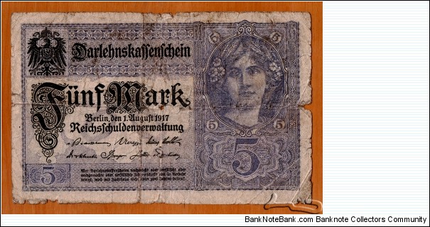 German Empire | 
5 Mark, 1917 | 

Obverse: Portrait of a German Woman | 
Reverse: National Coat of Arms | 
Watermark: Ornamental repeated pattern | Banknote
