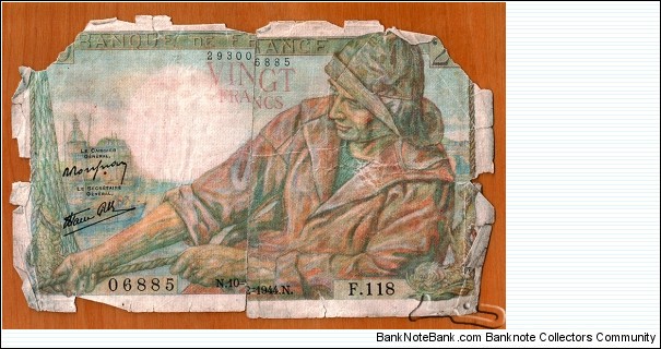 France | 20 Francs, 1944 | Obverse: Breton fisherman pulling a rope with a fishing net, Other fishermen, Sight of the Port of Concarneau, and Mythical fish | Reverse: Breton women carrying baskets of vegetables and fruits with girl in arms, Notre Dame de la Joie chapel and Saint Nonna church in Penmarch, and Calvaire or Golgotha, a Crucifixion post in Penmarc'h, Brittany | Watermark: Effigy of crowned Anne, Duchess of Brittany (Anne de Bretagne) (1477-1514) in profile |  Banknote